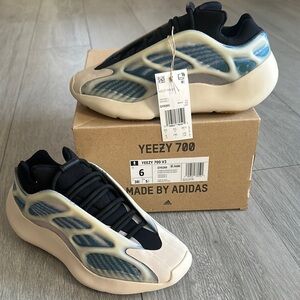 Yeezy Black and Blue Sneakers with Cage Design